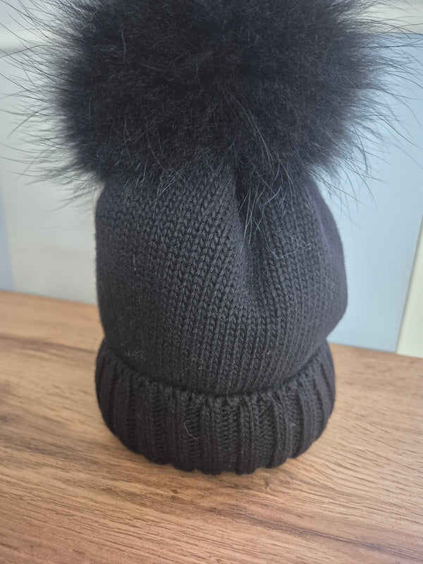 Cappello in lana con pom pon