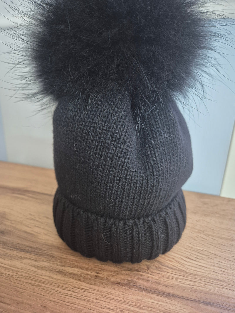 Cappello in lana con pom pon