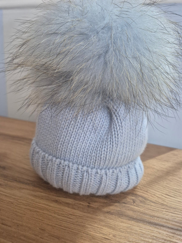 Cappello in lana con pom pon