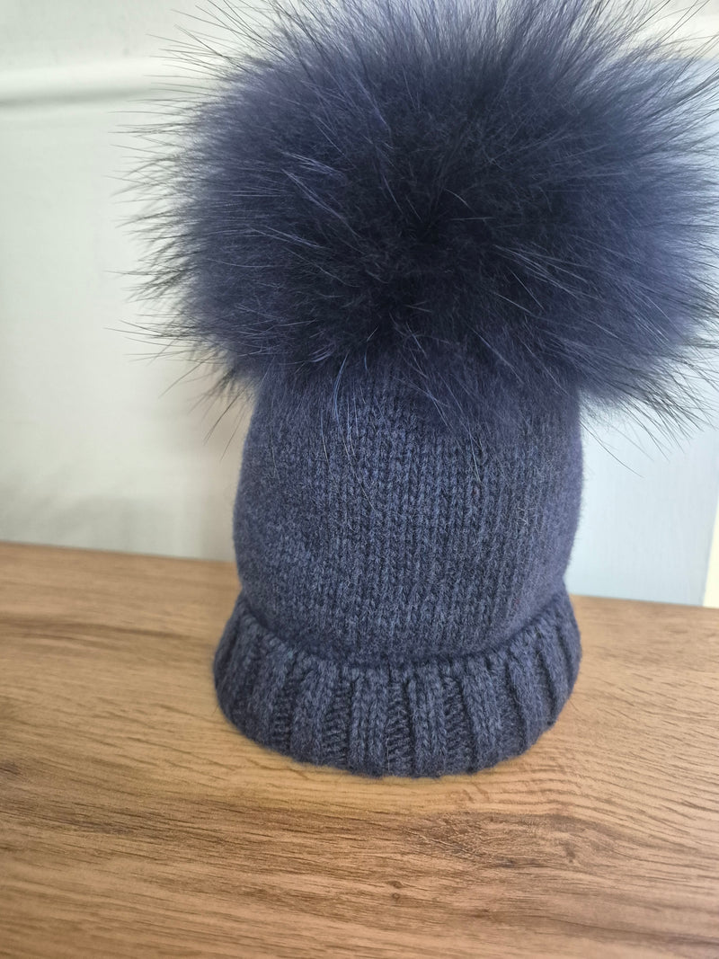 Cappello in lana con pom pon